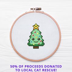 a cross stitch christmas tree on a white background with the text 50 % off proceeds donated to local cat rescue