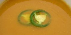 a close up of a soup with broccoli in it