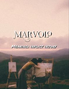 two people hugging each other in front of an easel with the words marvojq on it