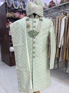 This is a premium Three Piece Suit by Groom Wear Studio crafted from high quality fabric and imported materials. Our products are handcrafted by experienced tailors who make sure the that the stitching is precise, lining is proper and the overall product is sturdy enough to not go out of shape for more than a few years. Also all our products have extra margins in their length, sleeves, sides so it's easily alterable if your size changes after some time. To see more available colours and designs Pista Green Kurta With Naqshi Traditional Drape, Pista Green Kurta With Naqshi In Traditional Style, Traditional Pista Green Kurta With Naqshi, Traditional Naqshi Kurta In Pista Green, Festive Pista Green Sherwani With Naqshi, Pista Green Bandhgala With Traditional Drape, Green Designer Sherwani For Transitional Season, Elegant Pista Green Sherwani For Eid, Pista Green Naqshi Sherwani For Wedding