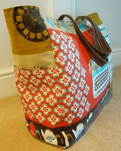 a colorful bag sitting on the floor next to a white door with a brown handle