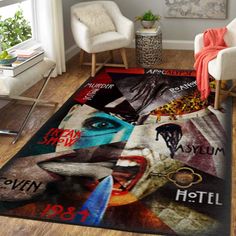 a living room area with a large rug on the floor and chairs in front of it