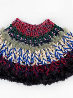 a multicolored knitted bag on a white background