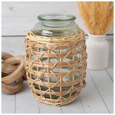 a glass jar sitting on top of a wooden table