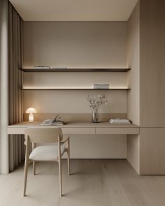 a desk and chair in a room with wooden flooring, beige walls and shelving