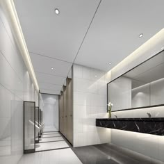 an empty bathroom with marble counter tops and white walls, along with black flooring