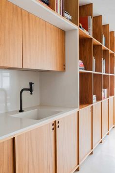 the kitchen is clean and ready to be used as a storage area for books or other items