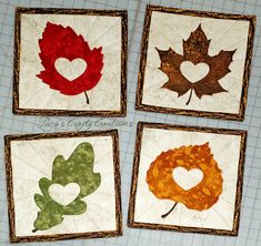 four quilted leaf coasters with hearts and leaves in the shape of heart on them