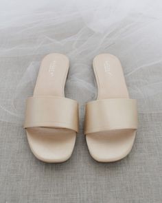 Classic slide flat sandals for casual and dressy look. Simple and easy wear for brides, bridesmaids and wedding parties.DETAILS:COLORS AVAILABLE: Ivory, Light Blue, White, Pink, and ChampagneUPPER: Synthetic upper and liningMATERIALS: Mandmade outsole STYLE NAME: EVELYN Bridesmaids Sandals, Name Evelyn, Sandals Glitter, Bridesmaid Sandals, Shoes For Brides, Low Block Heel Sandal, Women Flat Sandals, Sandals Wedding, Pearl Sandals