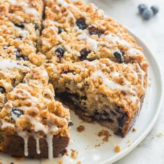 a blueberry crumb cake on a white plate