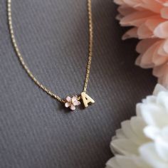 Personalized Cherry Blossom and initial necklace in gold. ▶▶ You can also add more letters from following link. https://www.etsy.com/listing/229265692/brushed-finish-letters-alphabet-monogram ▶ Material - Gold plated over brass ▶ Chain Length - 14 ~ 20 inches adjustable. ▶ Measure - Flower 6mm Letter H 7mm x W. 5mm ▶The matching bracelet available from following link. https://www.etsy.com/listing/191406481/cherry-blossom-bracelet-pink-flower https://www.etsy.com/listing/842121728/personalized-ch Dainty Personalized Flower Necklace For Wedding, Personalized Pink Flower Necklace, Pink Initial Pendant Necklace As Gift, Cute Personalized Flower Jewelry, Pink Initial Pendant Necklace For Gift, Pink Birth Flower Necklace For Anniversary, Pink Flower Charm Necklace For Anniversary, Personalized Gold Flower Necklace For Valentine's Day, Yellow Gold Initial Necklace For Wedding