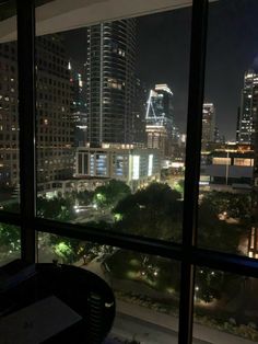 a view of the city from a window at night