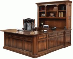 an executive desk with bookcase and chair