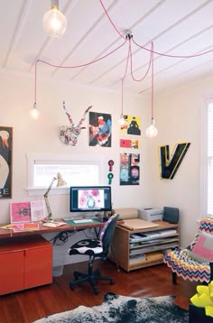 a home office with lots of clutter on the desk