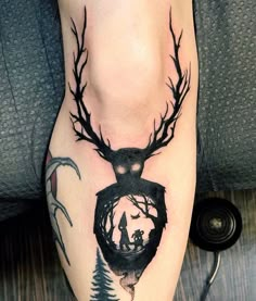 a deer with antlers on it's head is shown in this tattoo design