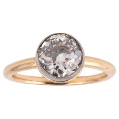 an oval shaped diamond ring in yellow gold