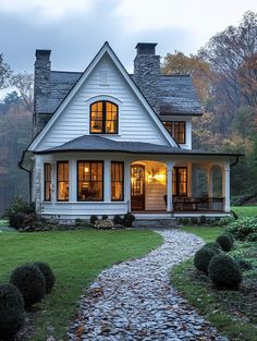 a white house with stone walkway leading to it