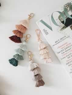 various tassels are laying on top of a magazine