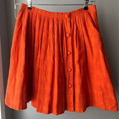 9-H15 Stcl Anthropologie Orange Pleated Skirt. Never Worn And Kept In Storage (Non-Smoking, No Pets Home). It Has Pockets, Lining, And Button Closure. Size 10 Waist: 30" Waist To Hem: 20 1/2" Wilfred Sonnet Skirt, Vintage Lined Mini Skirt For Summer, Vintage Summer Mini Skirt With Lining, Vintage Summer Lined Mini Skirt, Summer Vintage Lined Mini Skirt, Russet Skirt, Summer Vintage Mini Skirt With Relaxed Fit, Vintage Skort For Summer, Vintage Gathered Skirt Bottoms For Summer