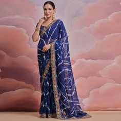 Blue colored saree is made from georgette fabric which is highlighted with beautiful printed work as shown. Comes along with unstitched mono silk blouse piece which you can customise as per your design/style. Occasion - You can wear this saree for party, functions and fashionista. Note:- the actual product may differ slightly in color and design from the one illustrated in the images when compared with computer or mobile screen. Measurements: Saree : Georgette : 5.5 Mtrs Blouse : Georgette : 0.8 Blue Georgette Pre-draped Saree With Pallu, Festival Georgette Pre-draped Saree With Printed Border, Festive Blue Georgette Pre-draped Saree, Georgette Saree With Bandhani Print In Traditional Drape, Georgette Saree With Bandhani Print, Navratri Chiffon Saree With Pallu Detail, Navratri Chiffon Saree With Pallu, Navratri Chiffon Pre-draped Saree With Pallu, Bollywood Chiffon Dupatta With Printed Border