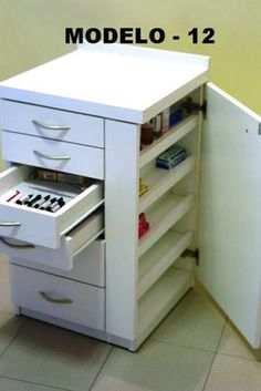 an open drawer in the corner of a white cabinet