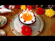 there is a cake that has been decorated with flowers and eggs on the plate,