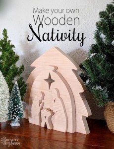 a wooden nativity scene with christmas trees