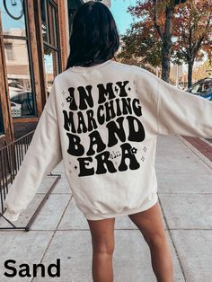 In My Marching Band Era Sweatshirt *please note this sweatshirt features both a front and back design Our Gildan 1800 sweatshirt fits true to size. This shirt has a unisex fit, nice fit on women, but men should SIZE UP at least one size.  Other details  .* 8.0 oz., 50/50 cotton/polyester  * Pre-shrunk  * Classic fit  * Reduced pilling and softer air-jet spun yarn  * 1x1 athletic rib knit collar, cuffs and waistband, with spandex  * Double-needle stitched collar, shoulders, armholes, cuffs and wa School Band Shirts, Foreigner Band, Marching Band Gift, Drummer Girl, Paramedic Gifts, Emergency Medical Technician, Band Director, Theatre Gifts, How To Play Drums