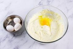 an image of eggs in a bowl with batter on the side and other ingredients to make it