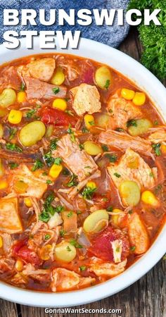 a white bowl filled with stew and vegetables