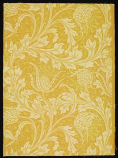 a yellow and black rug with an ornate design