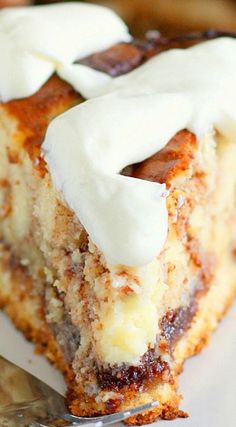 a close up of a piece of cake on a plate with a fork in it