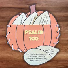 a paper cut out of a pumpkin with the words, psalm 100 written on it