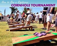 people are playing cornhole tournament in the grass with purple and green pillows on them