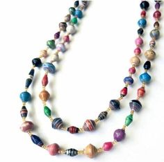 "This listing if for (1) multi-colored, Paper Bead Necklace. Wear it long, short, or, wrap as a bracelet! Absolutely gorgeous! Approximately 80\" long. Women in Uganda spend hours creating the beads before stringing them onto the gorgeous and versatile necklace.  Each bead is created by finely cutting paper, hand-rolling the paper into beads, and then stringing them together. This handcrafted paper bead necklace comes in a variety of other colors as well. Please see our other listings at: ThreadedBeadsWW.Etsy.com In partnership with Bead for Life, 10% of proceeds go to fund scholarships for female entrepreneurs. Women working at the cooperative earn fair wages which they invest in their families and education." Paper Bead Necklace, Make Paper Beads, Paper Beads Necklace, Paper Bead Jewelry, Fair Trade Jewelry, Long Beaded Necklace, Paper Beads, Cross Jewelry, Blue Necklace