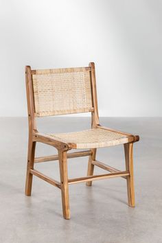 a chair made out of wood and wicker with a seat on the back side