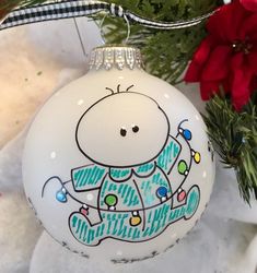 a white ornament with a cartoon character painted on it