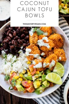 a white bowl filled with black beans, rice and other foods on top of a wooden table