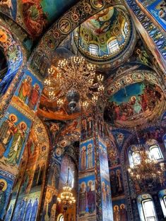 the interior of an ornate church with painted walls and ceilings