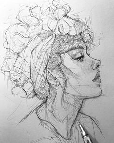 a drawing of a woman's head with flowers in her hair and a pen