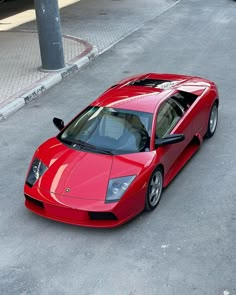 a red sports car parked on the street