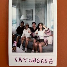 a group of people sitting on top of a couch