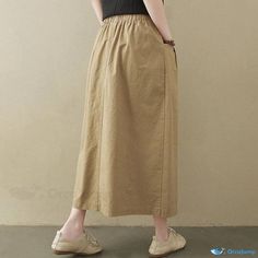 Orcajump - Long Textured Skirt for Women with Comfortable Fit Casual Non-stretch Skirt With Pockets, Casual Non-stretch Skirt With Elastic Waistband, Casual Baggy Skirt For Spring, Casual High Waist Non-stretch Skirt, Casual Khaki Maxi Skirt For Spring, Khaki Midi Skirt For Spring, Khaki Flowy Skirt For Spring, Casual Beige Skirt For Fall, Versatile Solid Color Midi Skirt