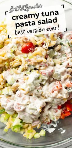 a bowl filled with pasta salad on top of a table