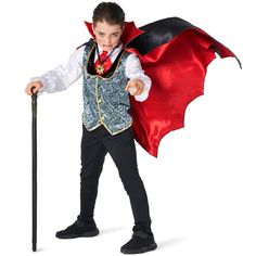 a young boy dressed up in a costume and holding a cane with a red cape on it