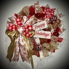 a christmas wreath made out of fabric and ribbon with the words happy holidays written on it