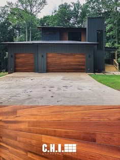 a large house with two garages on the front and one above it's roof