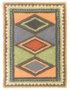 a multicolored area rug with squares and rectangles on the bottom, in various colors