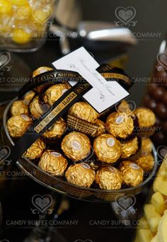 chocolates and candies are on display at a buffet