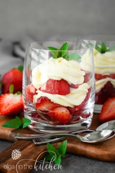 strawberries and cream dessert in a glass on a cutting board